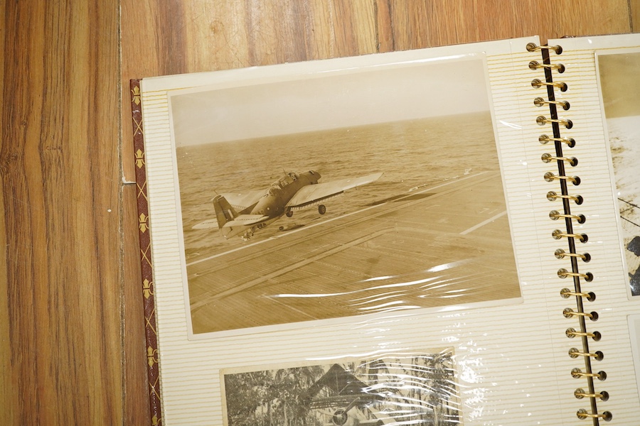 Two photograph albums containing an archive of WWII photos mainly of the RAF in Japan and the Far East, including a number of photos of RAF aircraft, aircraft carriers, Royal Naval ships, photographs of crew, military so